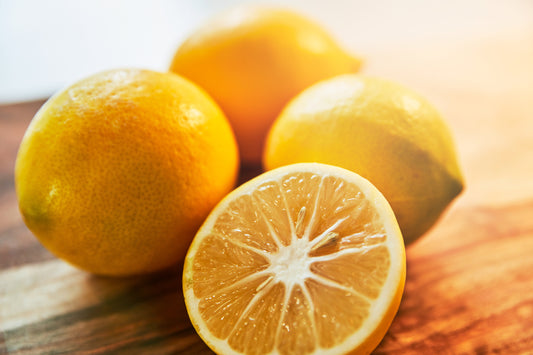 lemons in flare lighting on a wooden chopping block