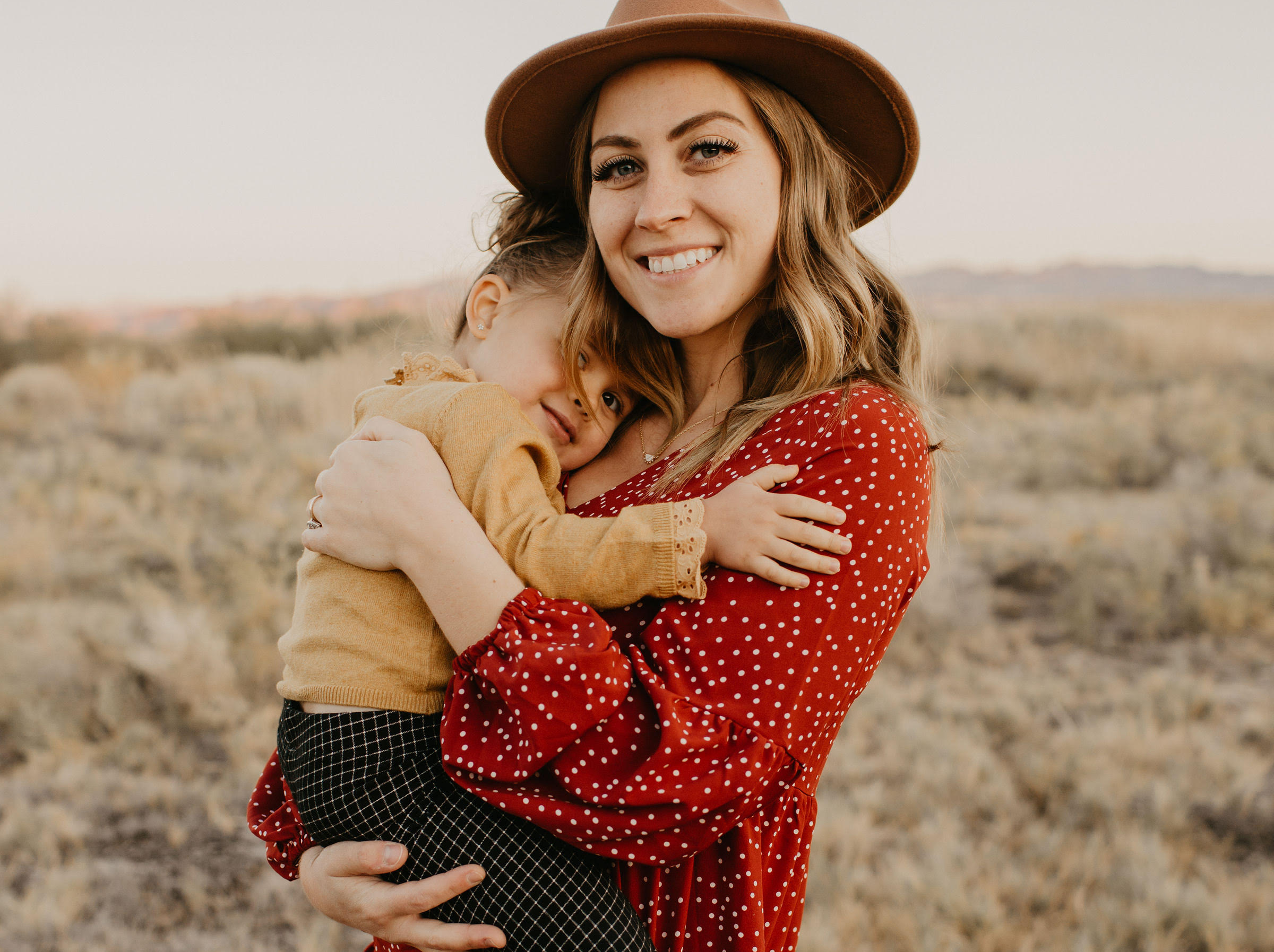 Skylar with her little girl in a field